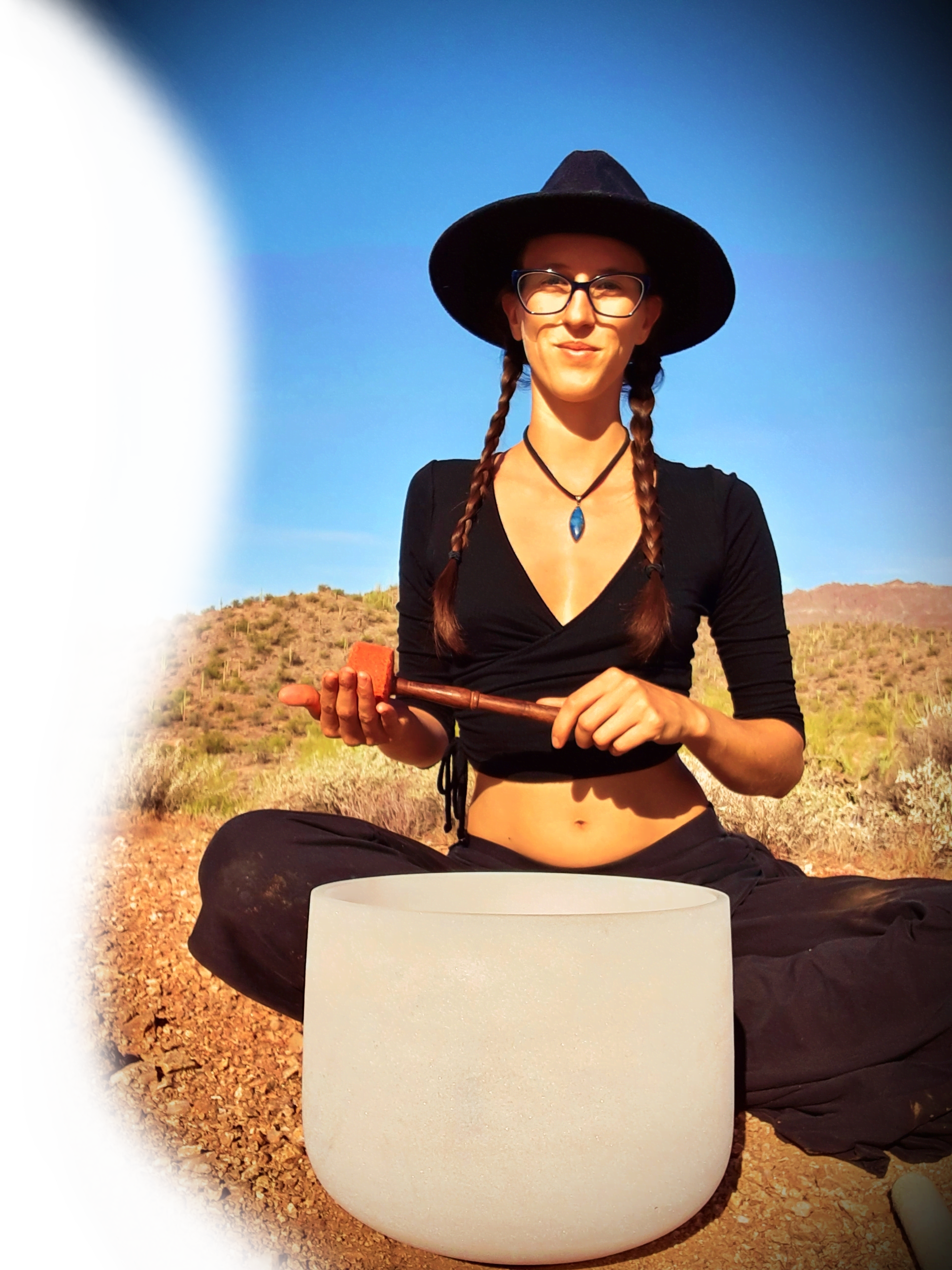 Emily Mayberry in the desert playing a singing bowl